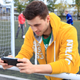 Illustration for article titled Attractive Young Men Smiling at the PlayStation Vita